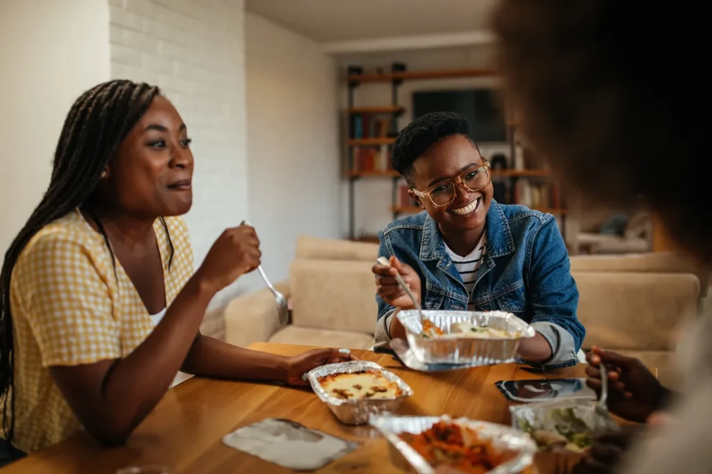 Adults sharing a meal and conversation