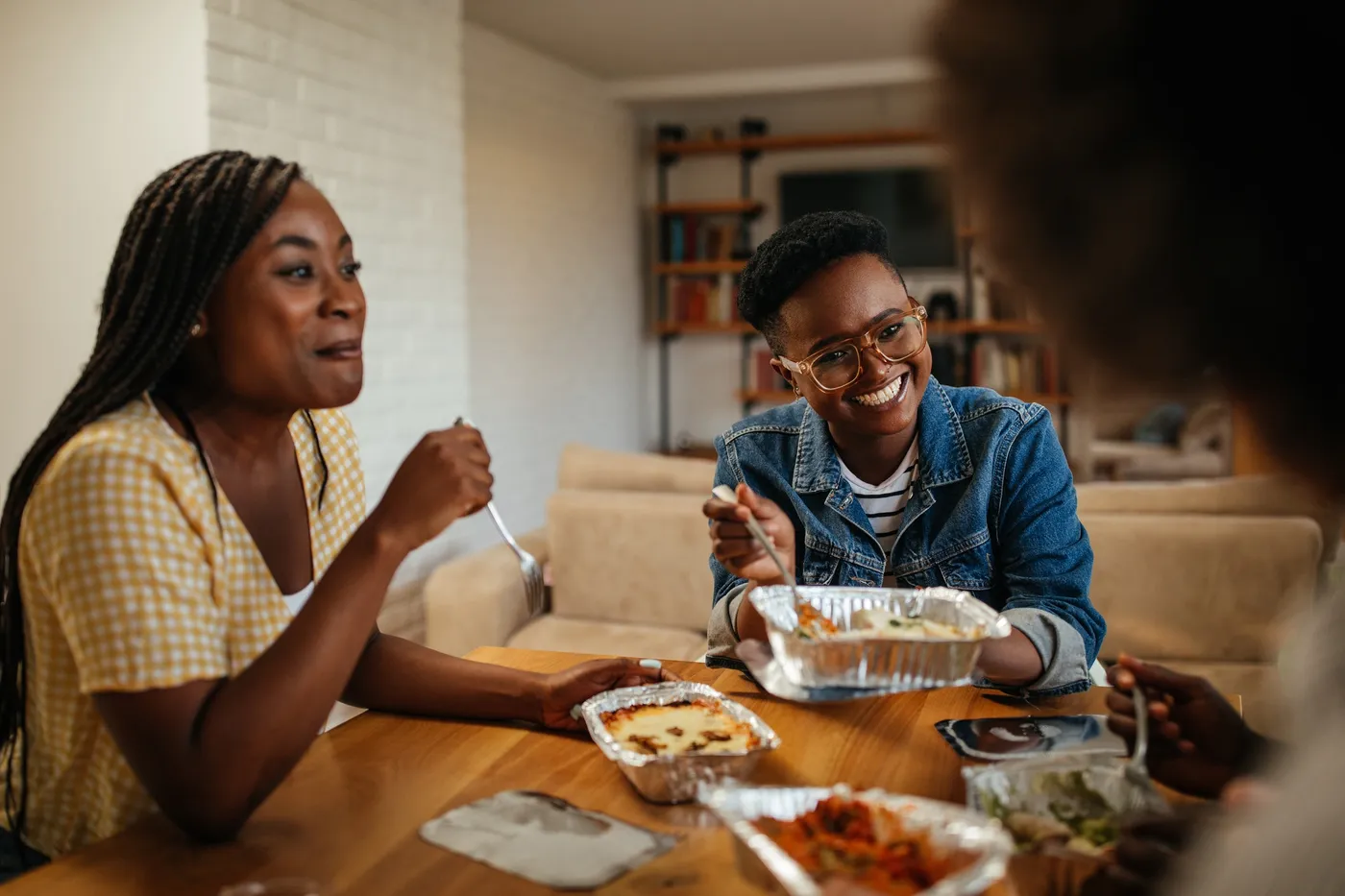 Adults sharing a meal and conversation